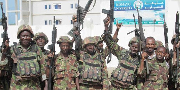 KDF soldiers celebrate outside Kismayo University after they took control from Al-Shabaab milititants in  2012. Kenya is now seeking cash from the UN to ease budgetary pressures. FILE
