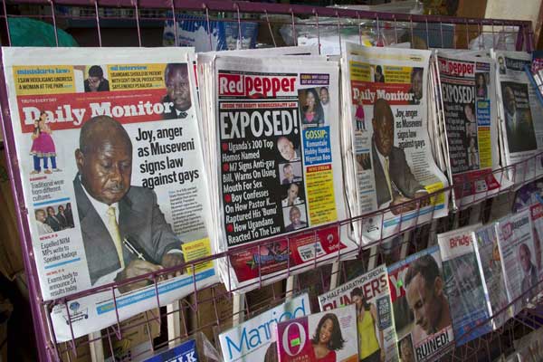A photo taken on February 25, 2014 shows a newspaper stand in Kampala after President Yoweri Museveni signed a bill into law which holds that repeat homosexuals should be jailed for life, outlaws the promotion of homosexuality and requires people to denounce gays. PHOTO | ISAAC KASAMANI