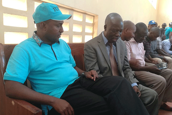 The MP (left), his lawyer Samuel Nyauke and