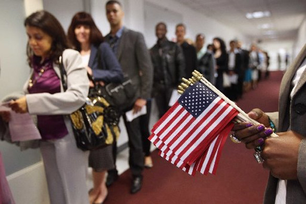 Immigrants at the US Citizenship and Immigration Services office on May 17, 2013 in New York City.
