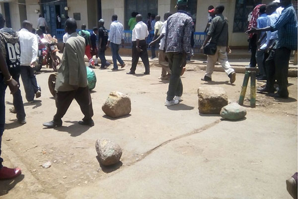 Youths block the entrance to Meru town main