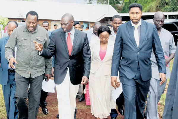 Deputy President William Ruto and his wife Rachael with Tigania MP Mpuru Aburi and Bishop Kiogora Magambo arrive at the Jesus House of Praise in Meru Sunday. Mr Ruto said every arm of government is accountable and criticised those who have opposed President Kenyatta’s decision to set up tribunal to probe six JSC members. PHOTO/PSCU