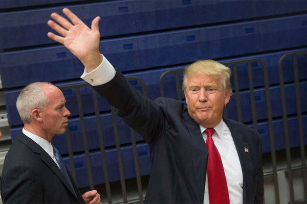 Republican presidential candidate Donald Trump waves to supporters as he leaves a rally on January 26, 2016 in Marshalltown, Iowa. Trump announced he will not participate in Thursday’s Republican debate, bowing out of a nationally televised showdown just four days before Iowa kicks off the presidential nomination process. PHOTO | SCOTT OLSON |