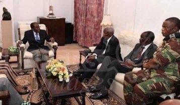 Mugabe, coup chief meet with smiles and handshakes