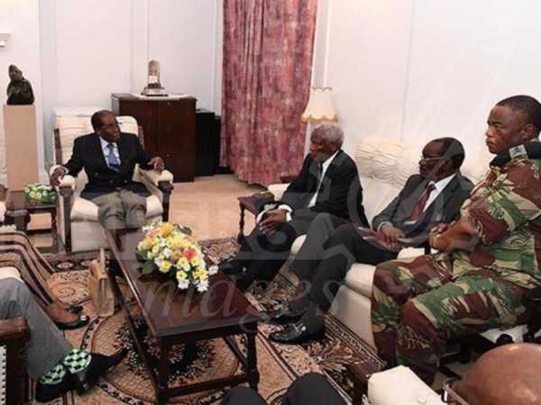 Mugabe, coup chief meet with smiles and handshakes