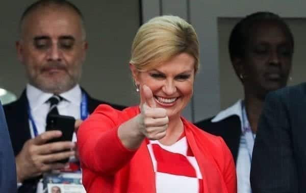 Croatian President celebrates in front of Russian PM after knocking the hosts out of World Cup