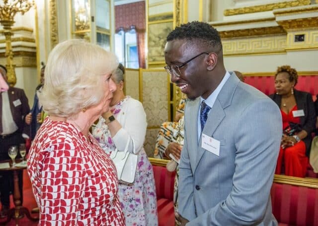 Kenyan Man Troy Onyango dines with UK royalty at Buckingham Palace.