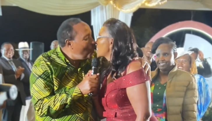 Waititu kissing wife at Kalonzo Musyoka' daughter's wedding